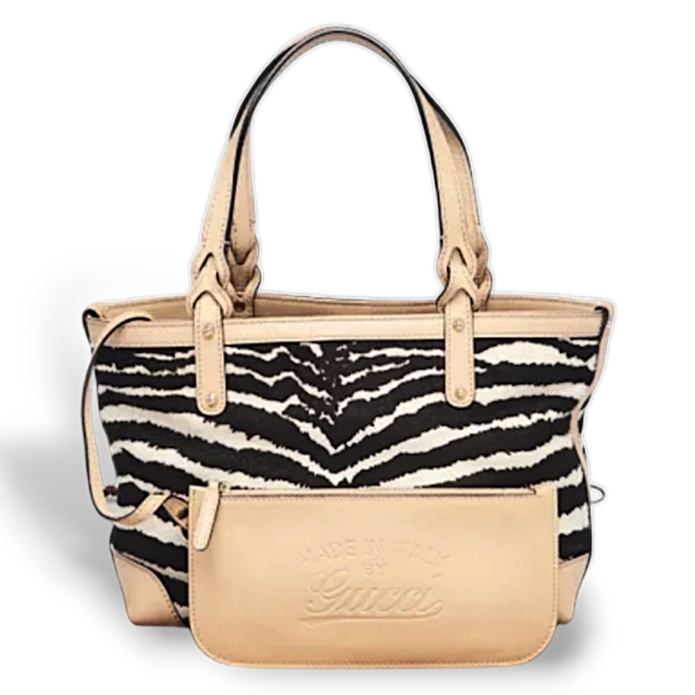 Gucci Zebra Purse and original dust bag and extra Gucci pouch shown in photo